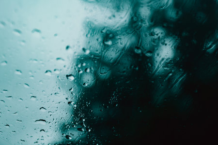 A minimalistic background of a crystal with water all over it on blue and black tones