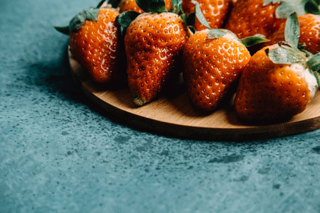 Some strawberries over a wooden plank with delicious aspectの写真素材
