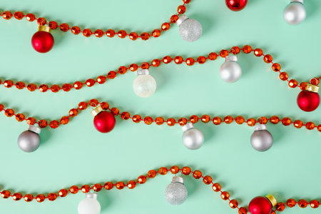 group of christmas bauble ball decoration on pastel green background