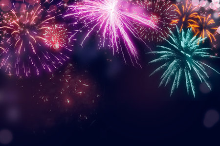 Holiday fireworks illustration; Abstract  colored fireworks background with copy space for text