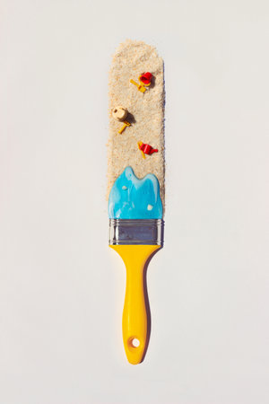 Summer vacation creative layout - paintbrush with sea and sand; Travel composition, flat lay, minimal conceptの写真素材