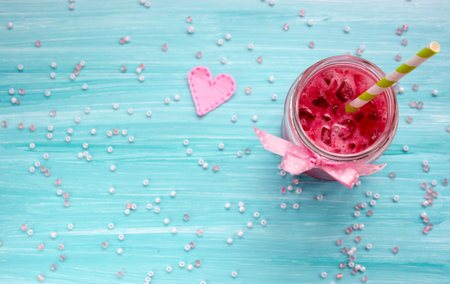 Strawberry smoothie on blue backgroundの写真素材