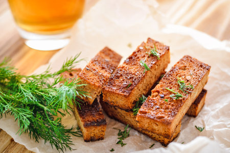 Rye croutons with dill and a glass of beer. Fast snackの写真素材