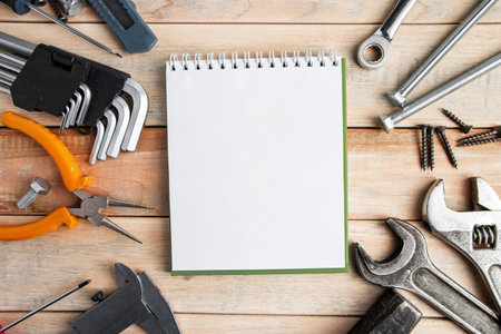 Set of work tools on a wooden background. Festive greeting card concept for Father's day