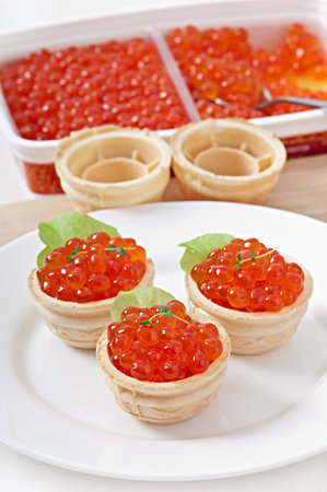 Tartlets with red caviarの写真素材