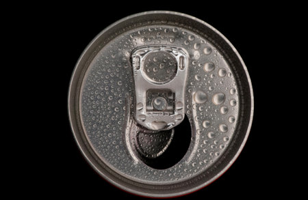 top of a can tin with water drops close-up on a black backgroundの写真素材