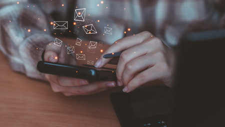 Businessman hand using smartphone with email sent out icon communication business technology texting...