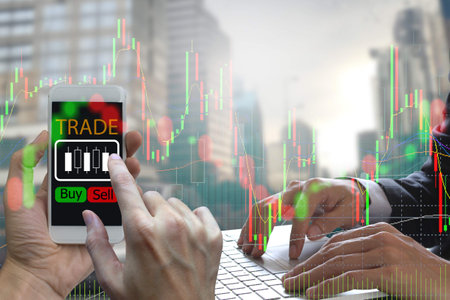 Double exposure of businessman Hand use smartphone and laptop trading online on screen with Candle...