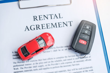 contract document with car and remote key. buy and sale, insurance, rental and contract agreement conceptsの写真素材