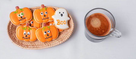 hot espresso coffee  or chocolate cup with funny Halloween Cookies. Happy Halloween day, Trick or Threat, Hello October, fall autumn, Traditional, party and holiday conceptの写真素材