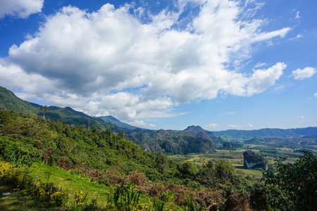 beautiful landscape big cloud on the open sky and foresty mountain below., Phayao Province, winter of Thailand.の写真素材
