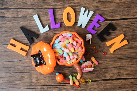 Happy Halloween day with ghost candies, pumpkin,  bowl and decorative. Trick or Threat, Hello...