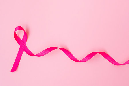 October Breast Cancer Awareness month, Pink Ribbon on pink background for supporting people living and illness. International Women, Mother and World cancer day conceptの写真素材
