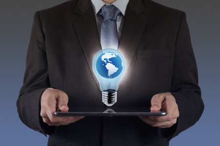 businessman hand shows success and globe as conceptの写真素材