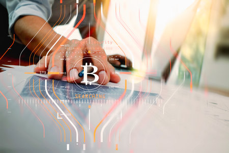 Businessman working with new modern computer and Bitcoin cryptocurry virtual diagram as concept.