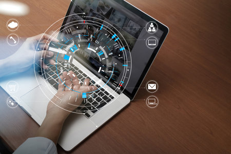 top view of Hand using credit card and laptop computer on wooden desk with VR icon chart graph...