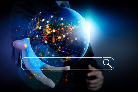 Searching Browsing Internet Data Information Networking Concept with blank search bar.Hand holding Global world telecommunication network connected around planet Earth.の写真素材