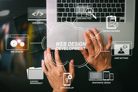 Developing programming and coding technologies with Website design in virtual diagram.cyber security internet and networking concept.Businessman hand working mobile phone on laptop computer backgroundの写真素材