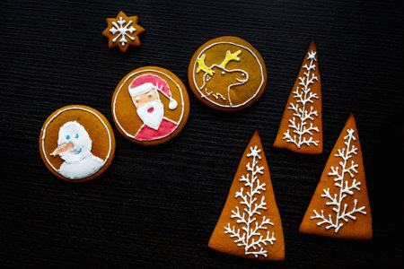 Handmade festive gingerbread cookies in the form of stars, snowflakes, people, socks, staff,...