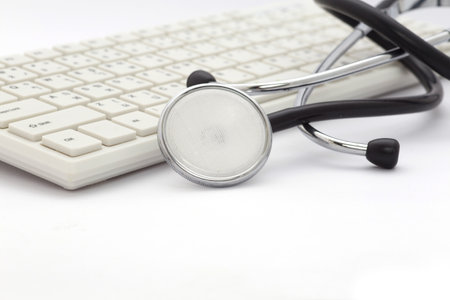 Stethoscope on the keyboardの写真素材