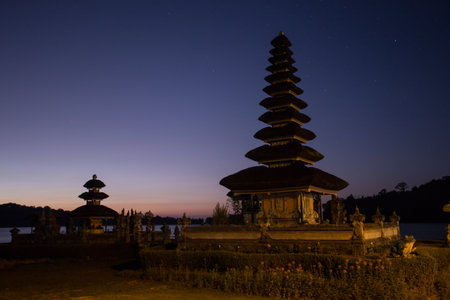 Pura Ulun Danu temple silhouette before sunrise on a lake Bratan. Bali, Indonesia