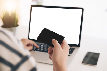 Online payment,Woman's hands holding smartphone and using credit card for online shopping.の写真素材