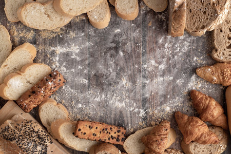 Bread and pastry flour on a wooden table and space for text