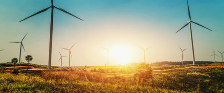 concept idea eco power energy in nature. wind turbine on hill and sunset