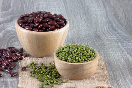 Mung bean and Red kidney bean in bowl place on the wooden table with copy space. Select focus...