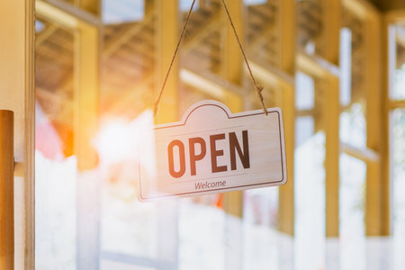 Open sign hanging on door cafeの写真素材