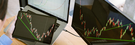 Stock Market Broker in formalwear Analyzing Graphs on  screens in the office, investment concept