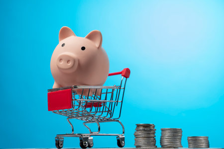 Shopping cart with coins money and white piggy bank. investment business sale and purchase. save and pay conceptの写真素材
