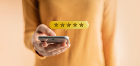 Customer Experiences Concept. Happy Client Using Smartphone to Submit Five Star Review Rating for...