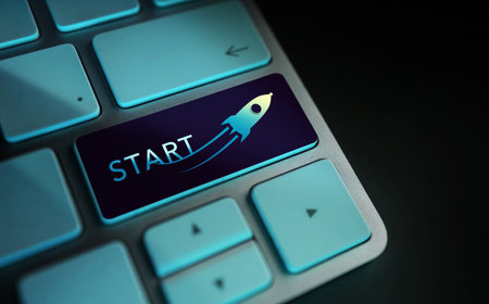 Start, Challenge, Start-Up and Motivation Concept. Close Up of Rocket and Startup Sign on Computer Keyboard. Dark toneの写真素材