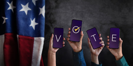 Voting Concept. Election in America. Group of People Raised Mobile Phone with Text Vote. Blurred...