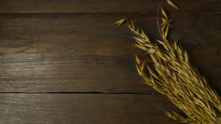 The rice oat on wood table for background.