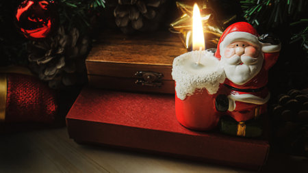 The Santa Claus candle on wood table for Christmas  content.の写真素材