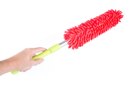 man hand holding with microfiber feather duster on white background
