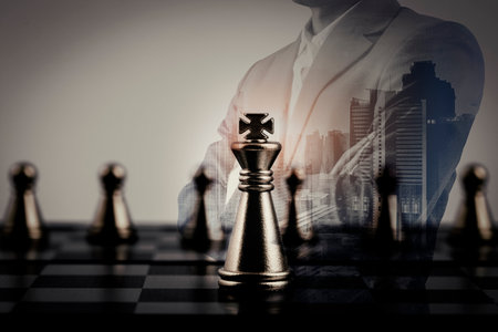 Double exposure of businessman with chess board game of business ideas and competition success play strategy, management or leadership conceptの写真素材