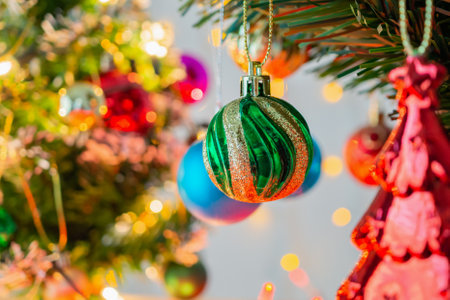 Christmas tree decorated with baubles on pine branches backgroundの写真素材
