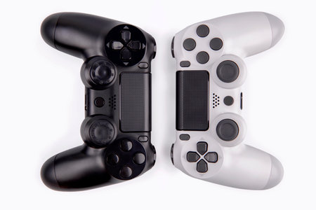 Joystick gaming controller isolated on white background , Video game console developed Interactive...