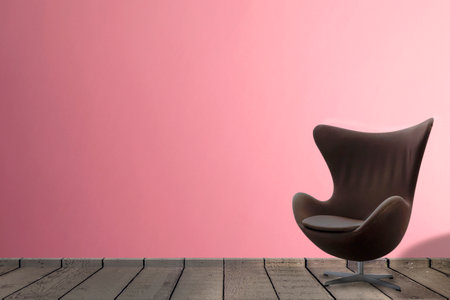living room in pink tones wall with chair in a waiting room interior parquet wood floor with copy spaceの写真素材