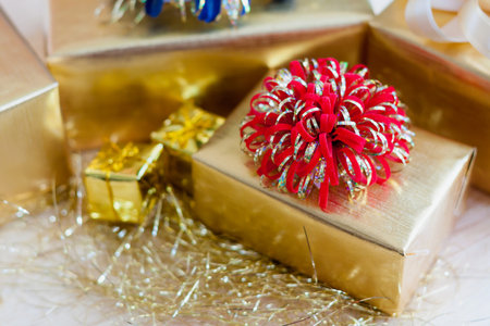 golden gift box on wood table for christmas background