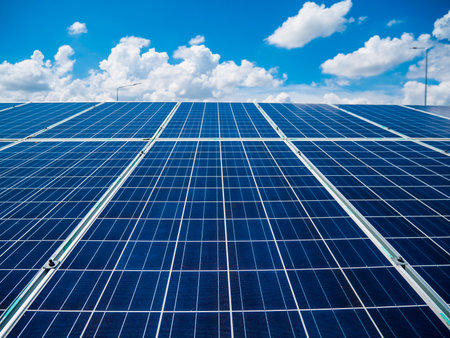 Solar panels with blue sky and clouds, solar energy environmentally friendly green energyの写真素材