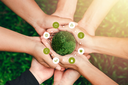 the globe in the hands of the family in environmental conservation ideas environmental protection Elements of this image decorate environment icons.の写真素材