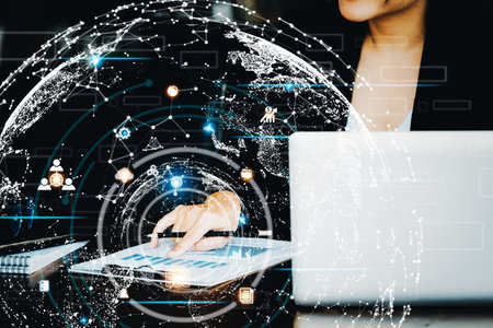 Investment concepts, businesswomen use document and computers to analyze stock markets, quantitative data collection, financial statement analysis, profitability through internet technologyの写真素材