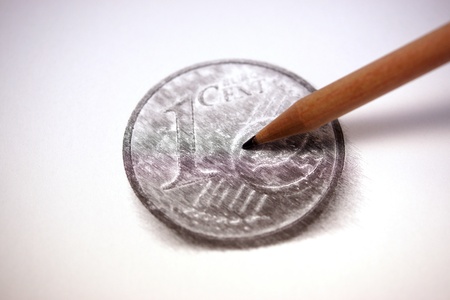 Painting the coin using a pencilの写真素材