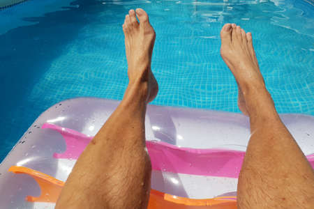 With air mattress in the poolの写真素材