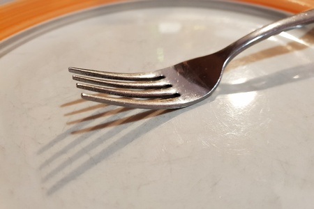 Fork on the plateの写真素材