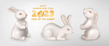 Rabbit is a symbol of the 2023 Chinese New Year. Set of three figurines of white ceramic Rabbits isolated on a white background. Vector realistic 3D illustration of decorative Bunnyのイラスト素材